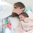 Load image into Gallery viewer, Mom places Ollie tooth fairy pillow under little girls pillow before bed