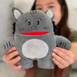Load image into Gallery viewer, Person holding a gray plush cat toy with a red mouth
